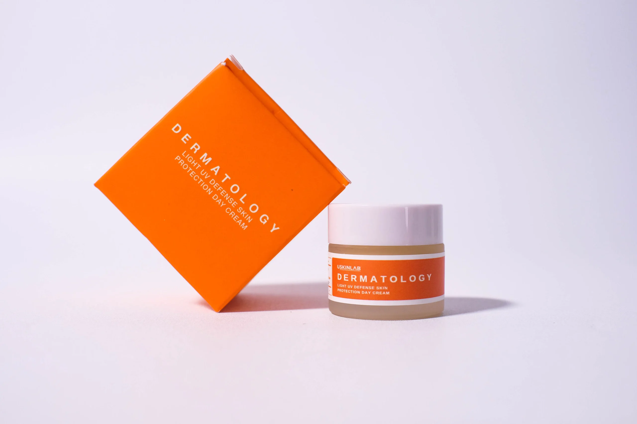 Dermatology Light UV Defense Skin Protection Day Cream jar and box.